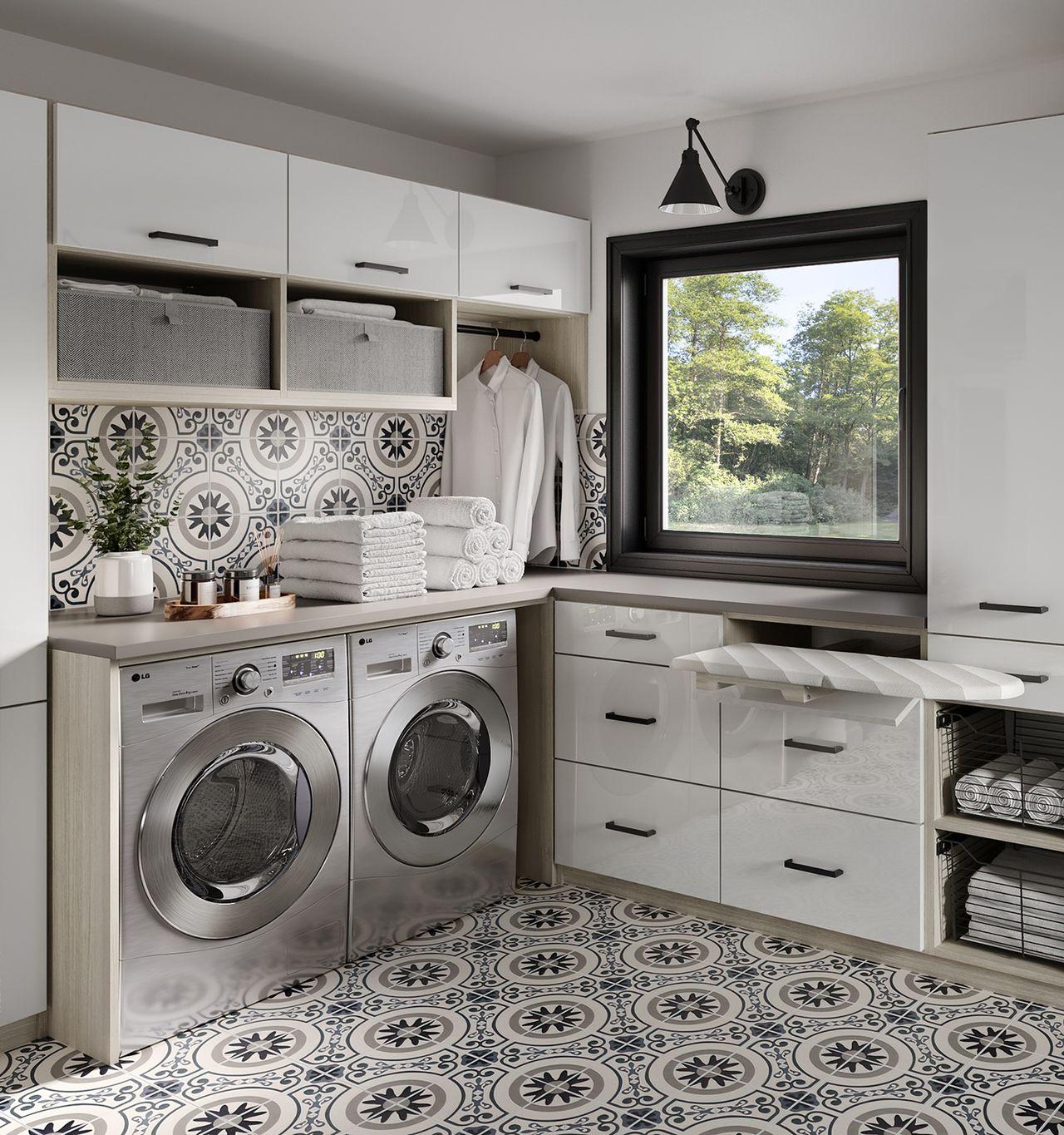 Laundry room and utility room design that has shelves, cabinets, and linen storage in white gloss finish by California Closets