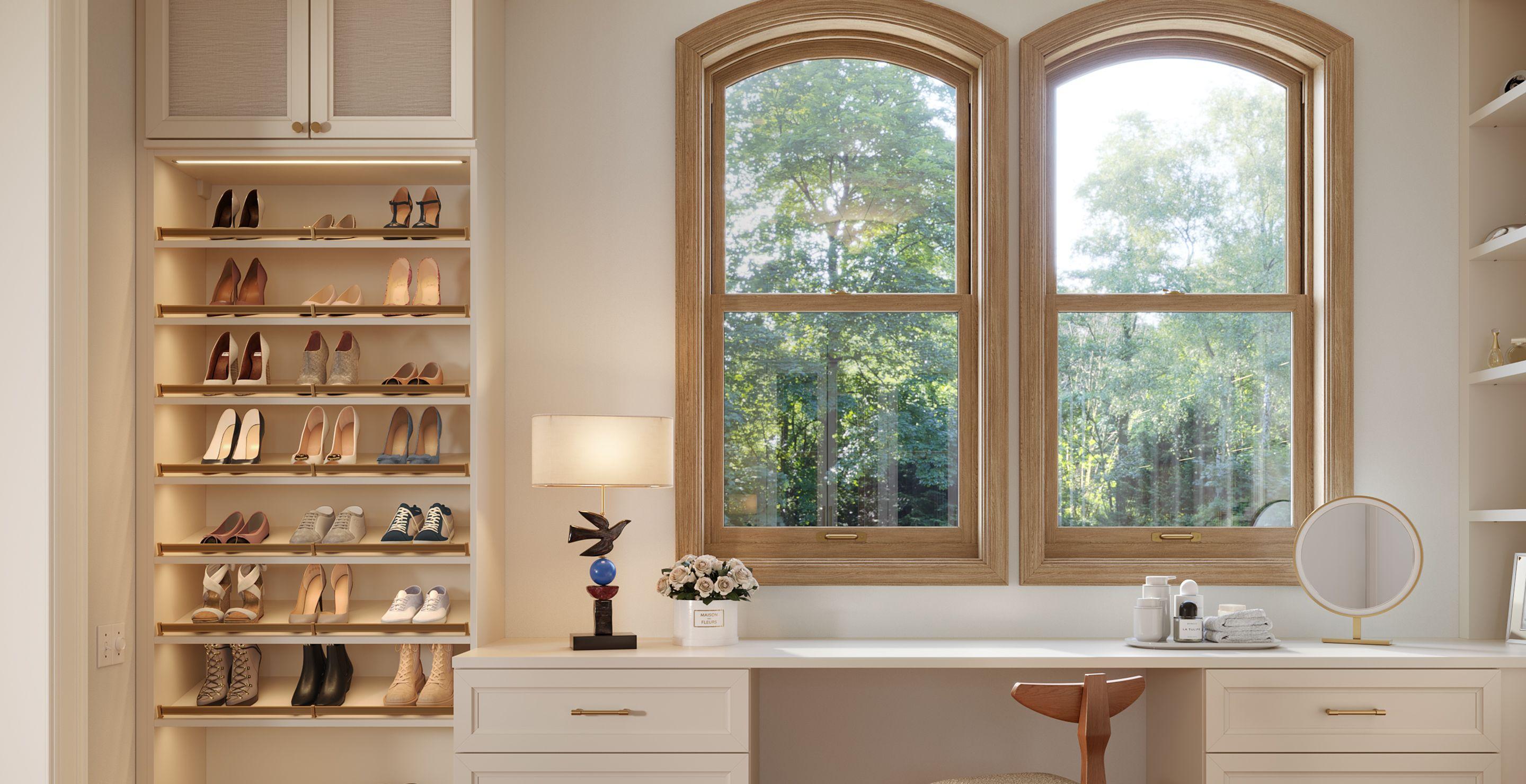 Dressing wardrobe room with home office design in light wood grain finish by California Closets
