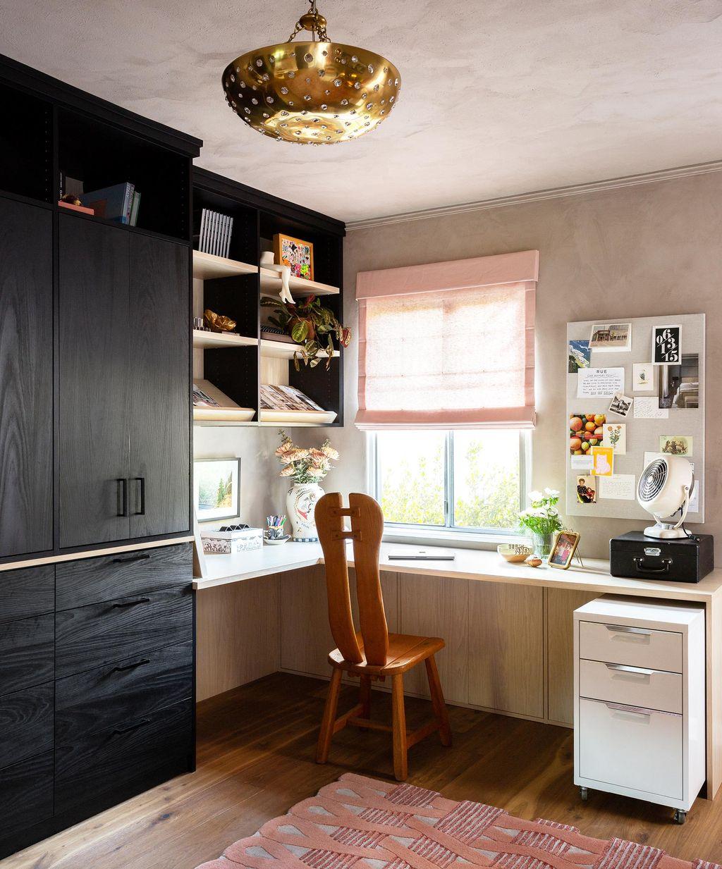 Workspace design in corner with tall shelving cabinets and wrap desk by California Closets