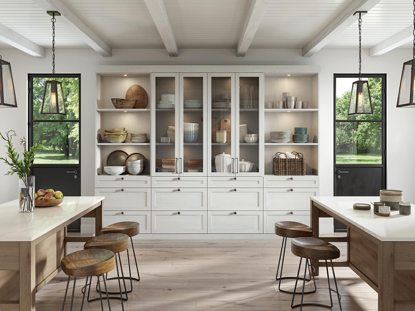 Kitchen pantry with custom lights, glass cabinets, and drawers in a white finish by California Closets