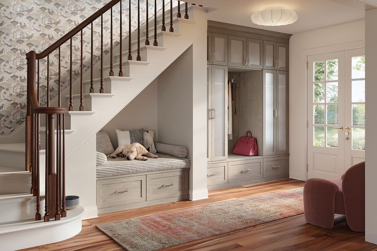 Entryway design with custom cabinets, closet doors, bench with pet bed and shoe storage by California Closets. Activate to enhance image.