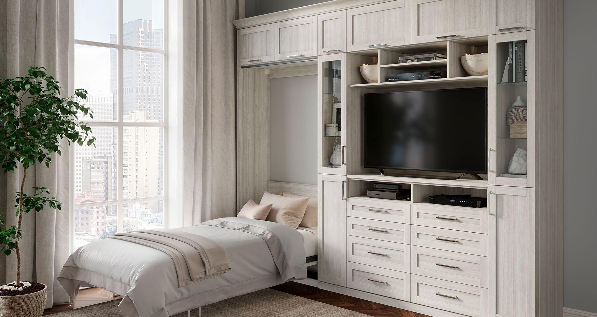 Cama murphy inclinable vertical con escritorio y estanterias integradas diseno de California Closets