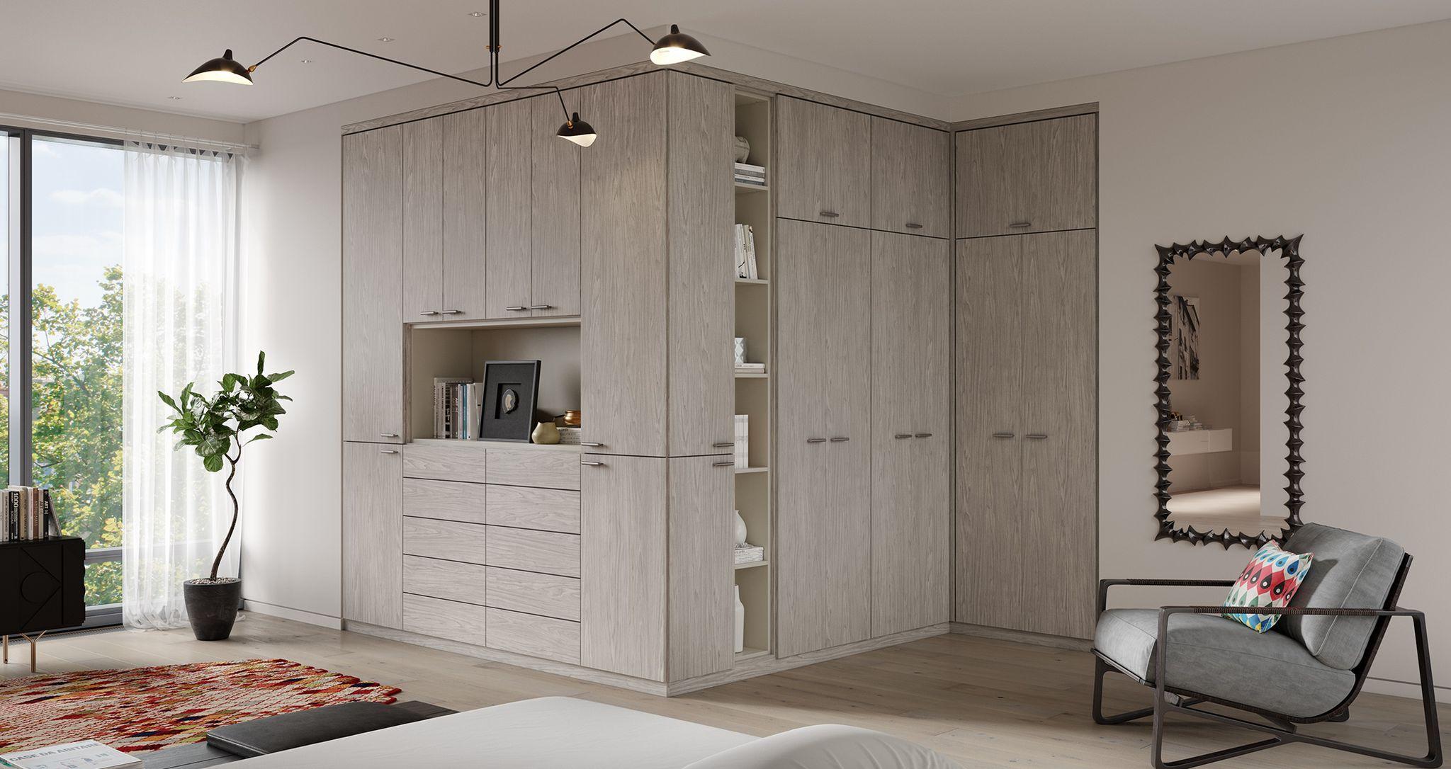 Corner wrap closet storage cabinets, drawers and open shelving in light grey finish by California Closets