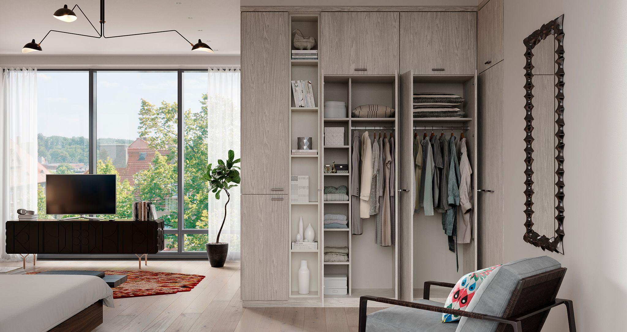 Wrap corner closet in minimalist design with custom cabinets and shelves in light grey finish by California Closets