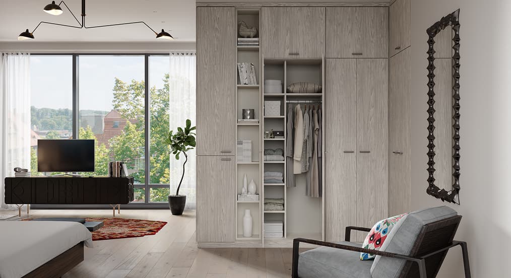 Sustainable floor-to-ceiling light wood wardrobe system with custom cabinets and open shelving for small space organization