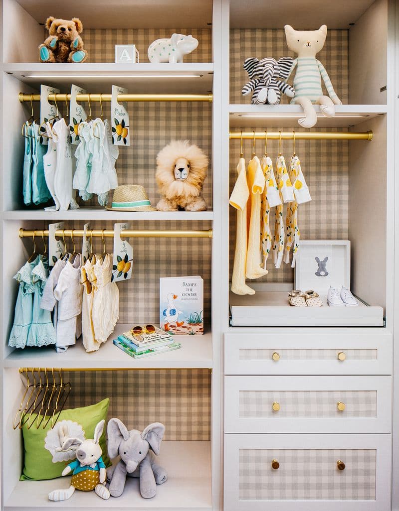 Kid's closet organized shelving for clothes, toys and shoes designed by California Closets