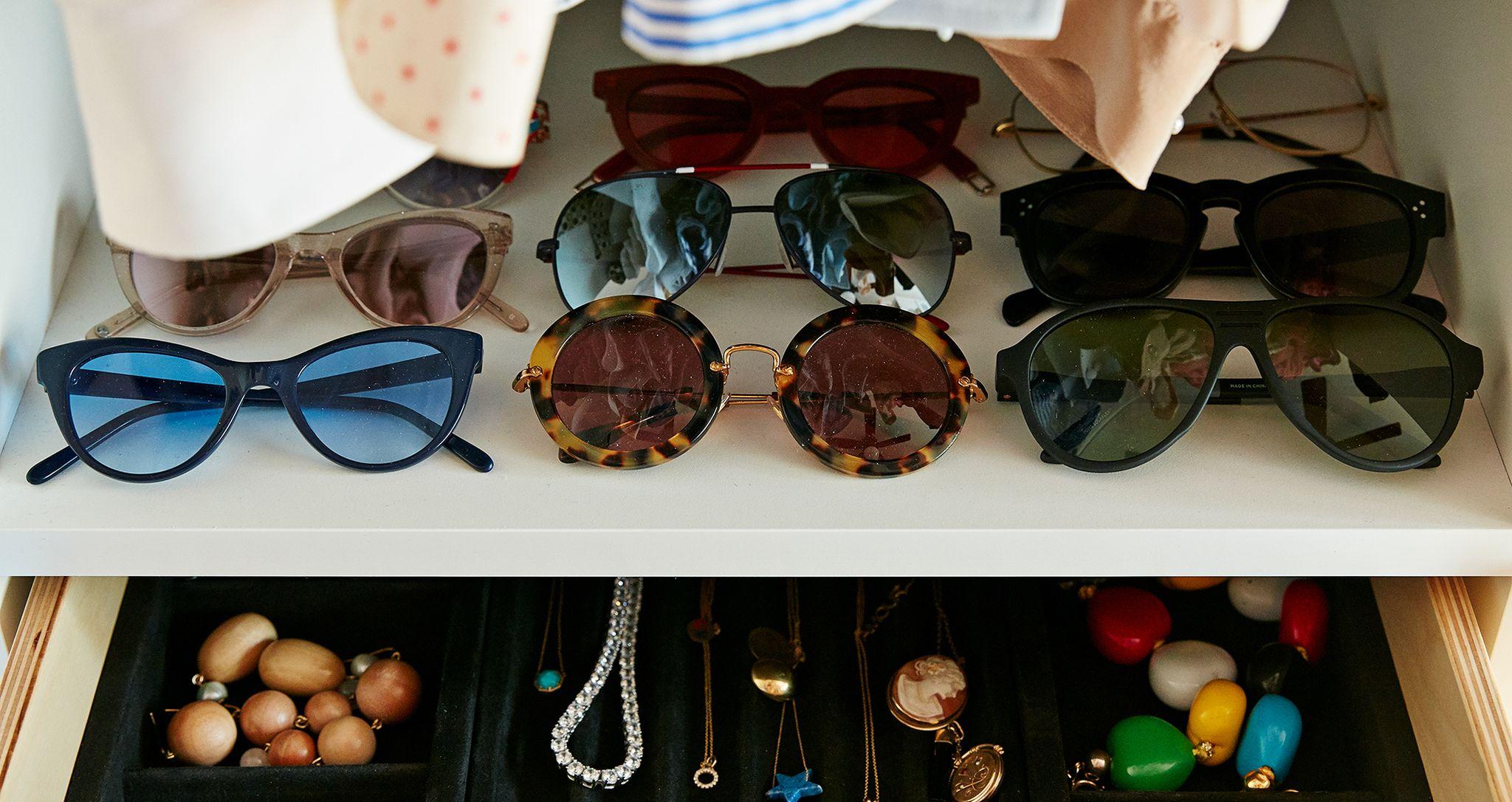 Walk in closet close up of sunglasses assortment and jewelry box for Clare Vivier by California Closets