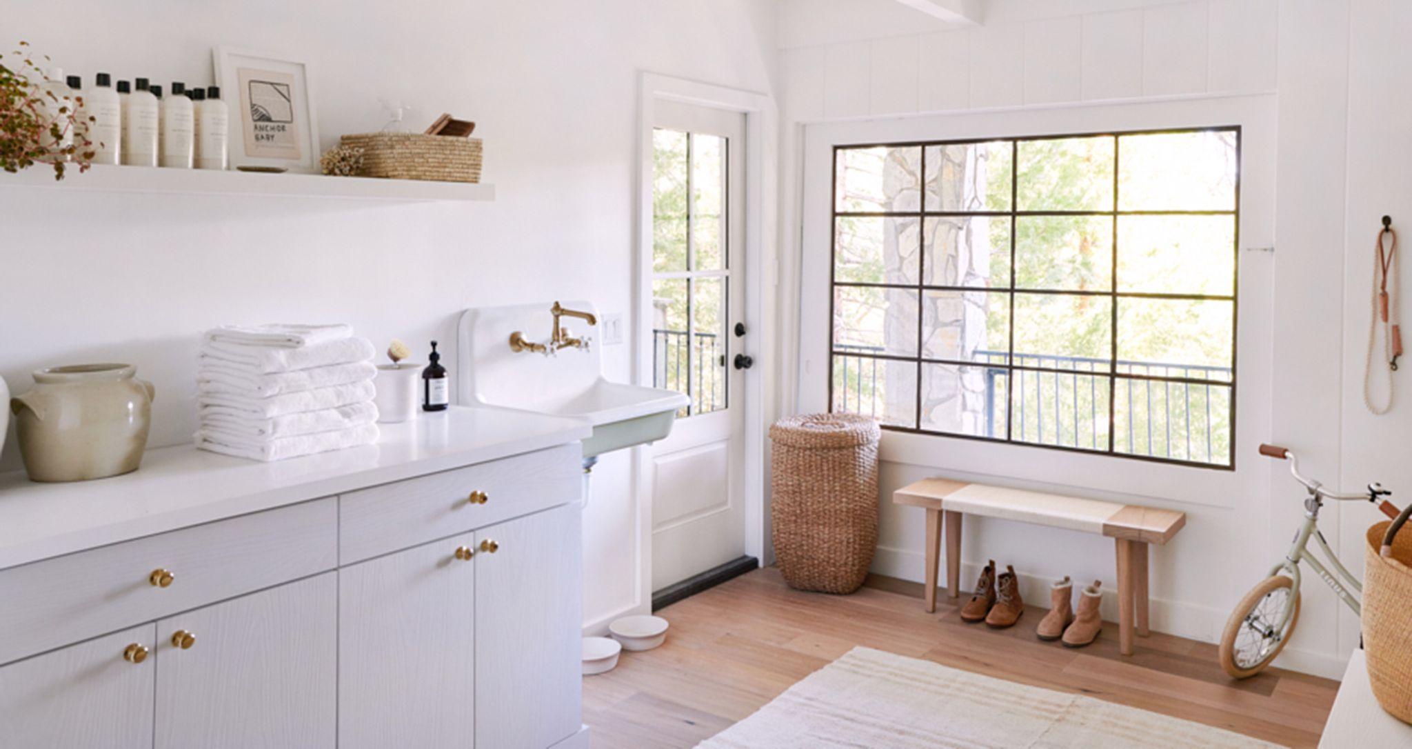 Large mudroom with cabinet storage, counter tops and shelving created by California Closets