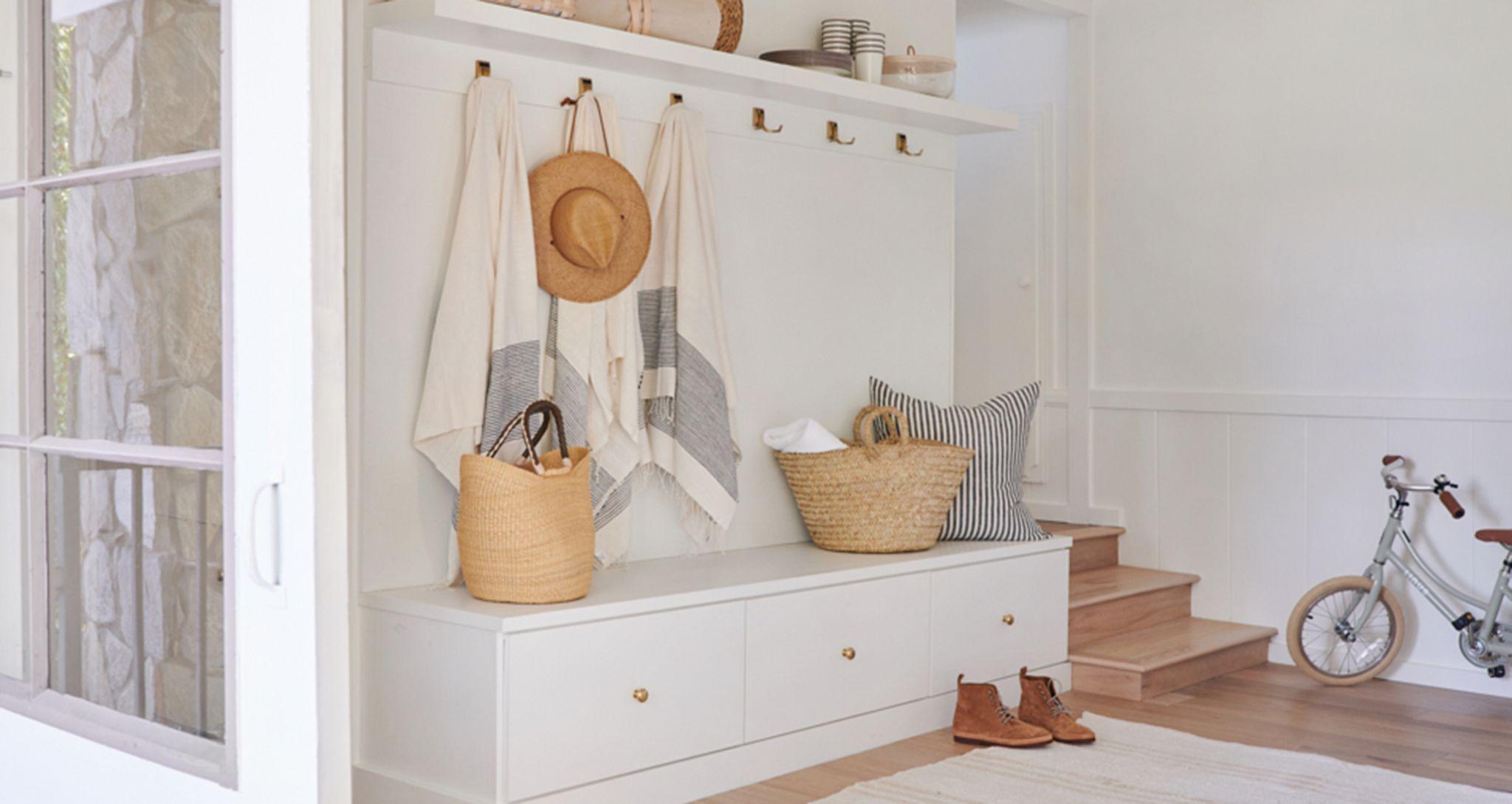 Custom mudroom storage drawers and bench at Jenni Kayne's home California Closets