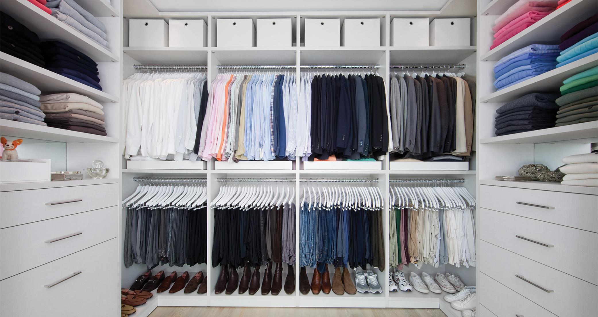 Custom classic white finish designed walk in closet with dresser drawers created for Kevin Sharkey by California Closets