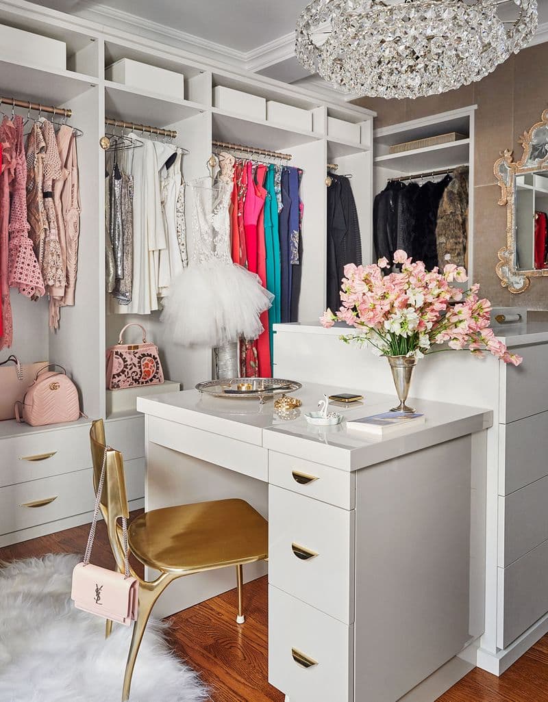 Misty Copeland's walk-in closet with custom built vanity in front of open shelving created by California Closets