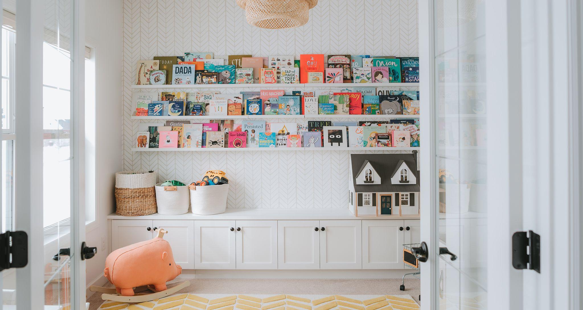 Playroom storage organization with custom built in shelving, cabiinets, and counterspace for toys by California Closets
