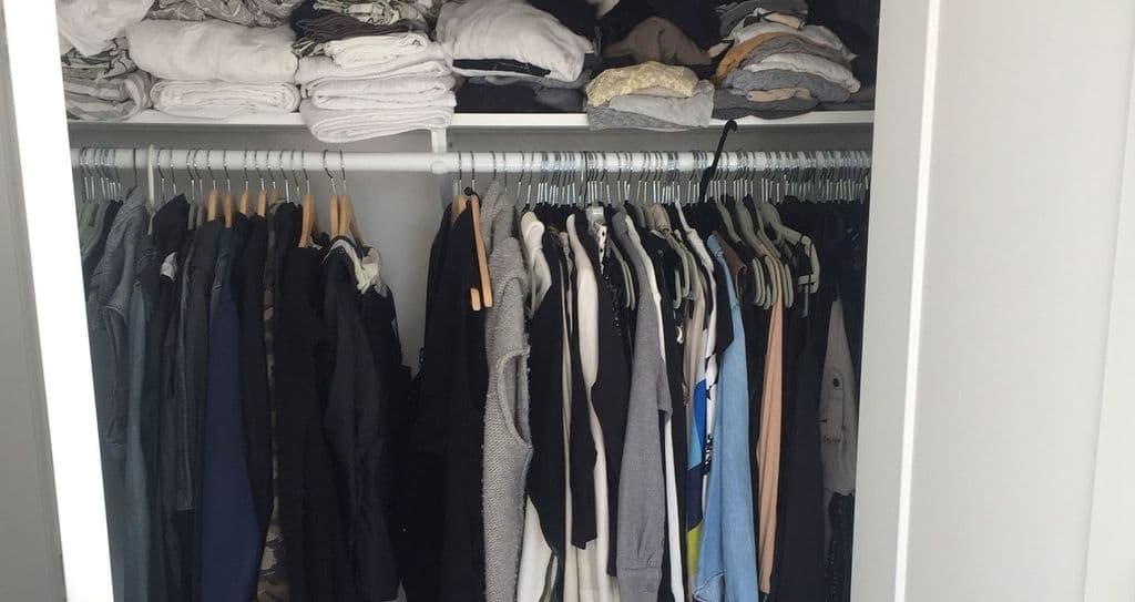 Client Erin Swift's unorganized closet before installation by California Closets
