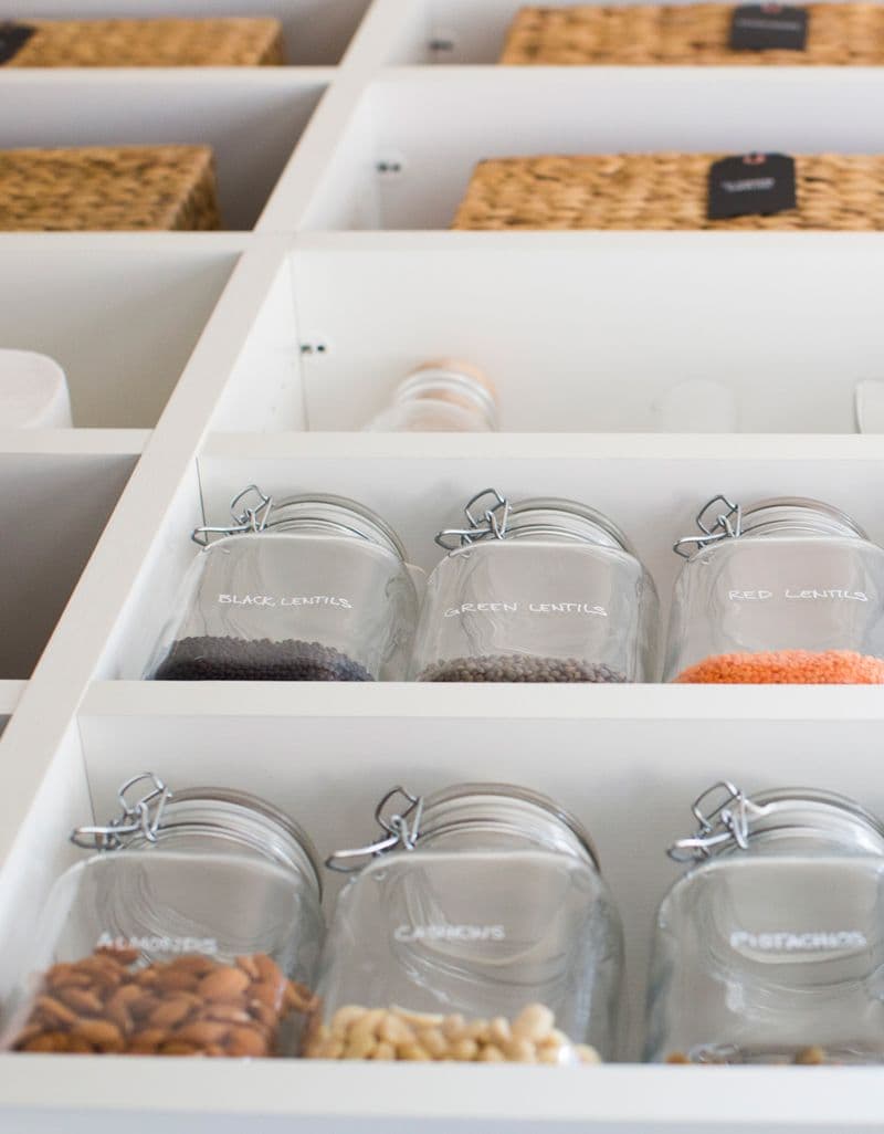 Custom kitchen pantry storage with open shelving for spics and gadgets by California Closets