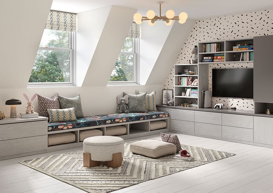 Custom playroom converted from an unused attic space with toy storaage media center, cubbies, and library shelves for kids created by California Closets