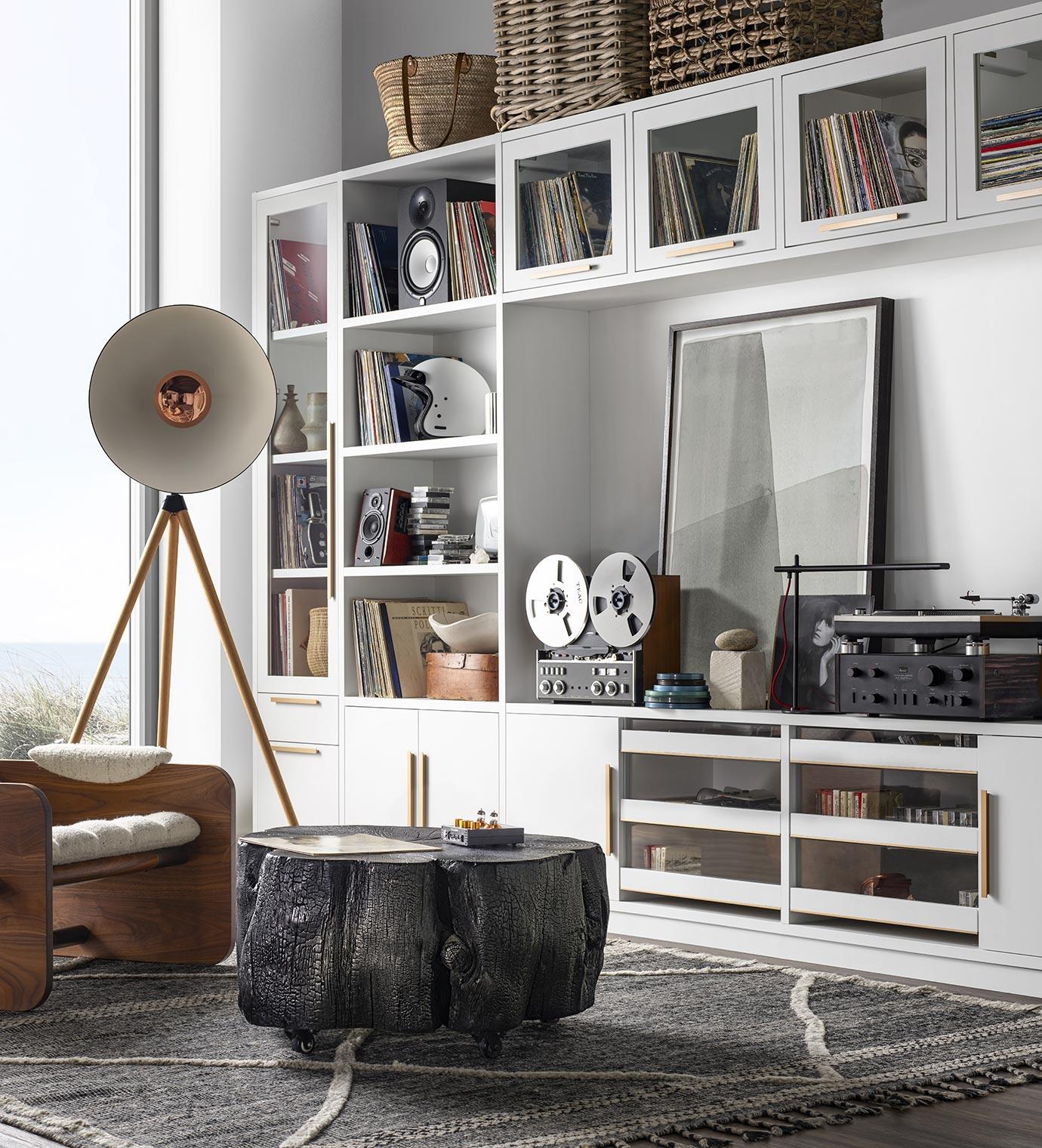 Retro-designed loft with custom entertainment center storage in white wood finish by California Closets