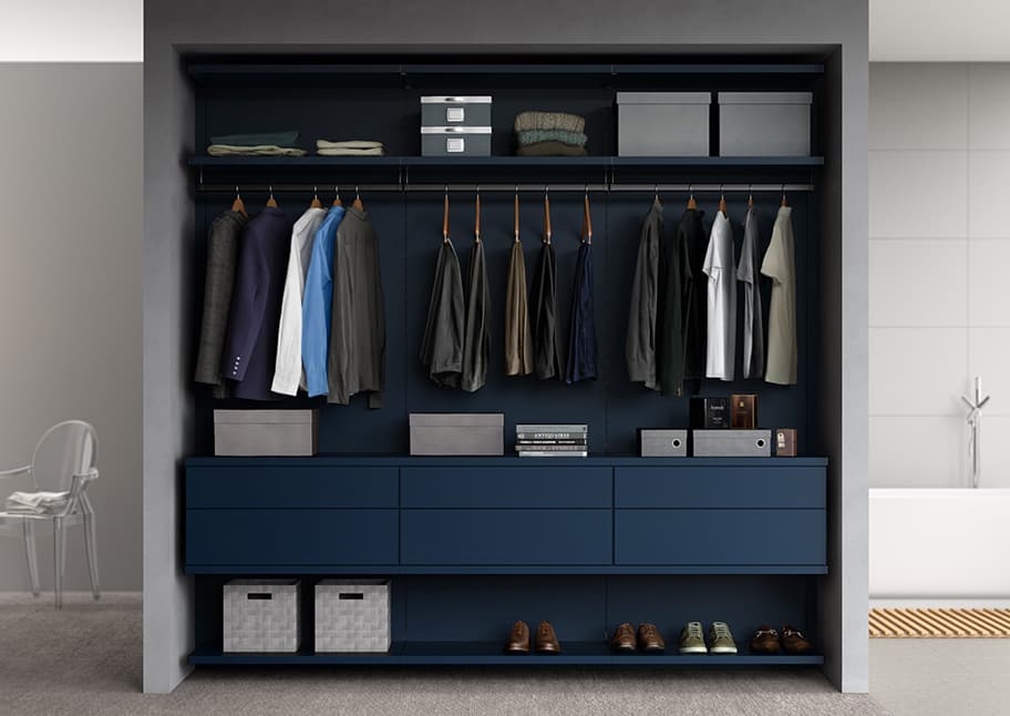 Custom closet in reach in style with vertical shelving, overhead storage and clothing poles by California Closets.