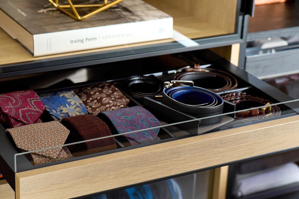 Custom built closet drawer for ties and belts custom designed by California Closets