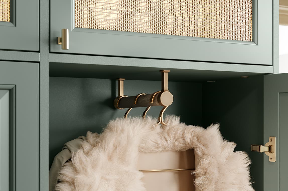 Front-to-back closet rod mounted under a shelf in a shallow cabinet by California Closets