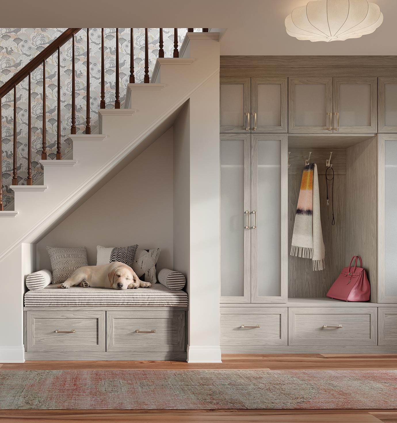 Entryway with drawers, cabinet design, and built-in dog bench in light wood gray finish by California Closets