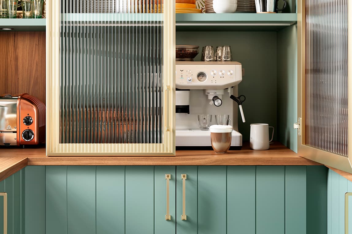 Custom pantry design with green finish cabinets and transluscent doors from California Closets