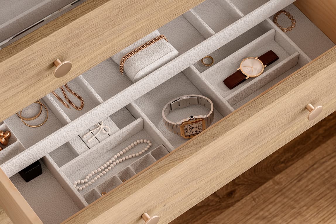 Custom drawer insert with top tray organizer to hold jewelry, watches, and accessories by California Closets