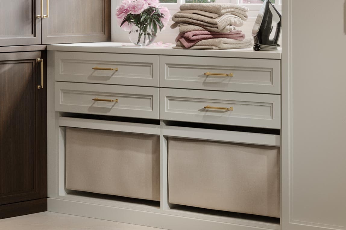 Custom laundry room small space under window storage cabinets by California Closets