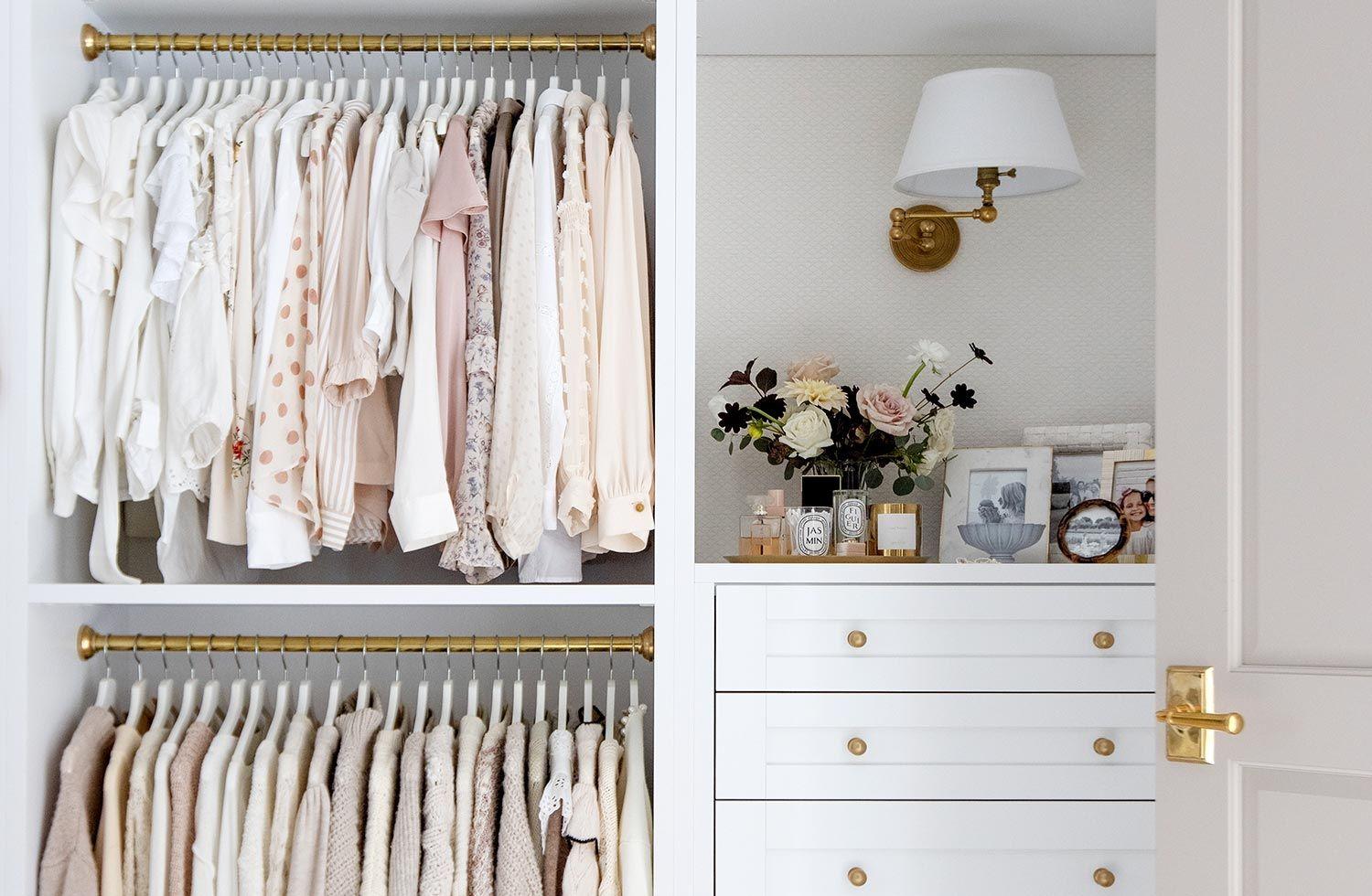 Reach in closet design with built in dresser drawers from California Closets
