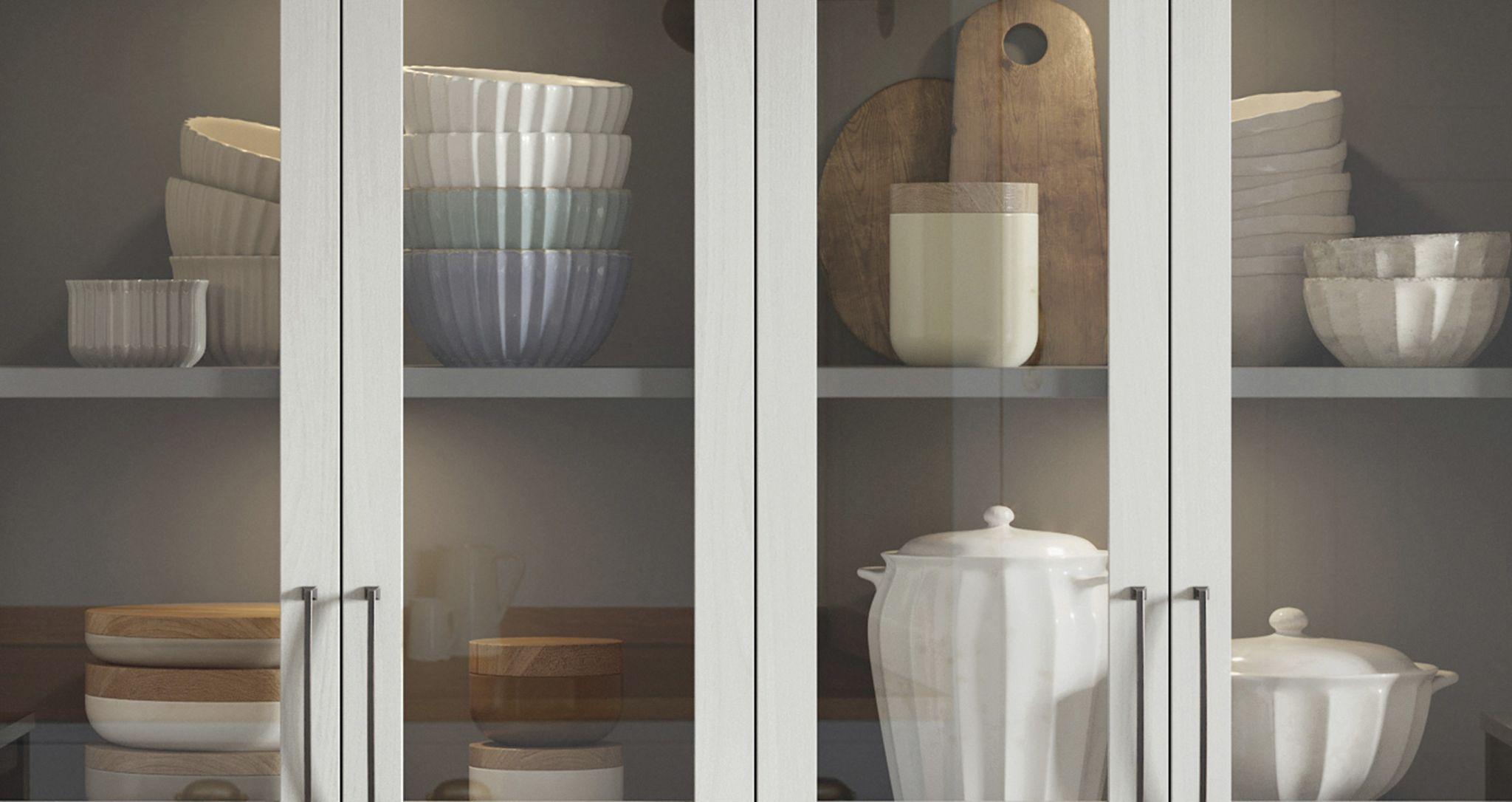 Clear cabinet door inserts on customized storage system created by California Closets