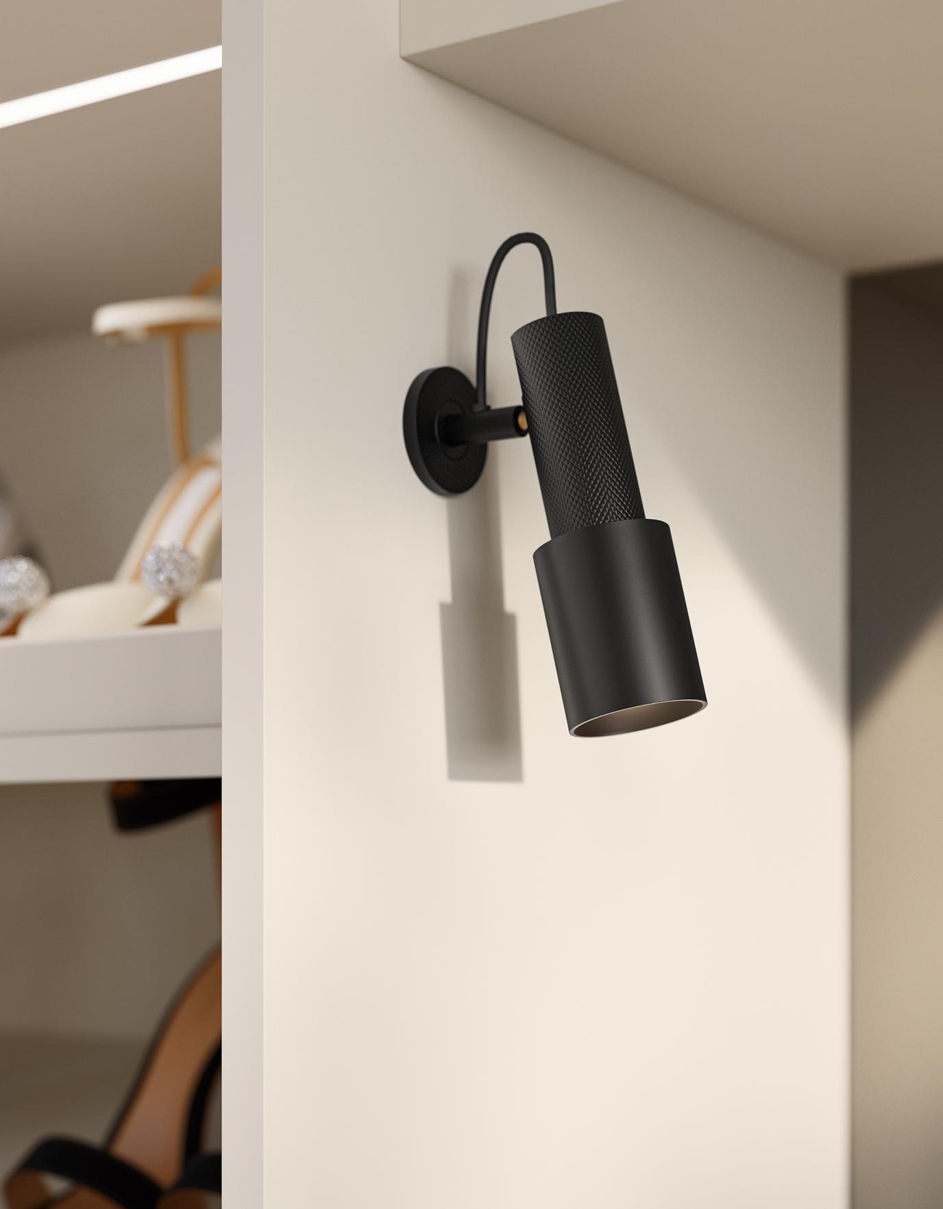 Modern matte black task spotlight mounted inside a white custom closet system by California Closets.