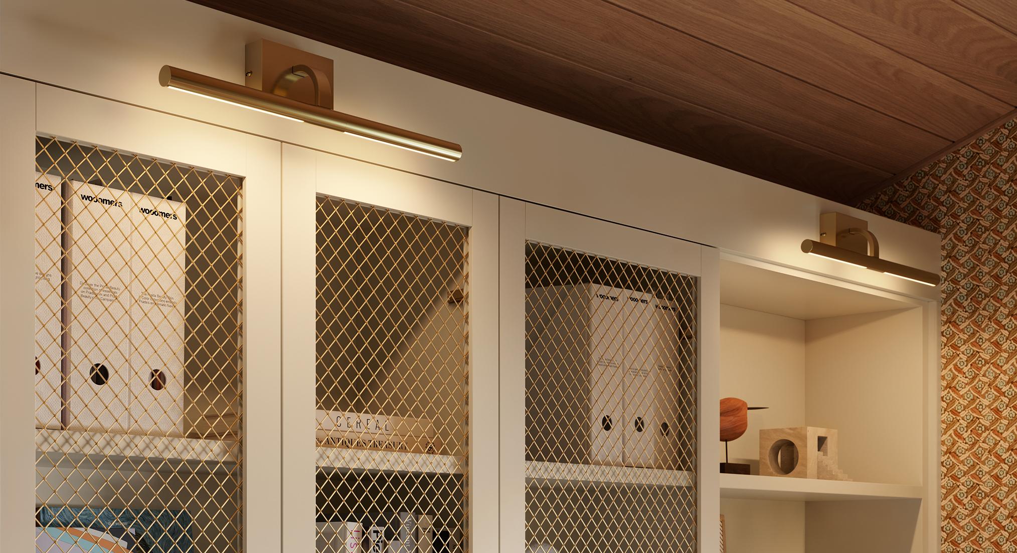 Custom storage cabinets with wire mesh doors featuring The Mona picture lights by California Closets.