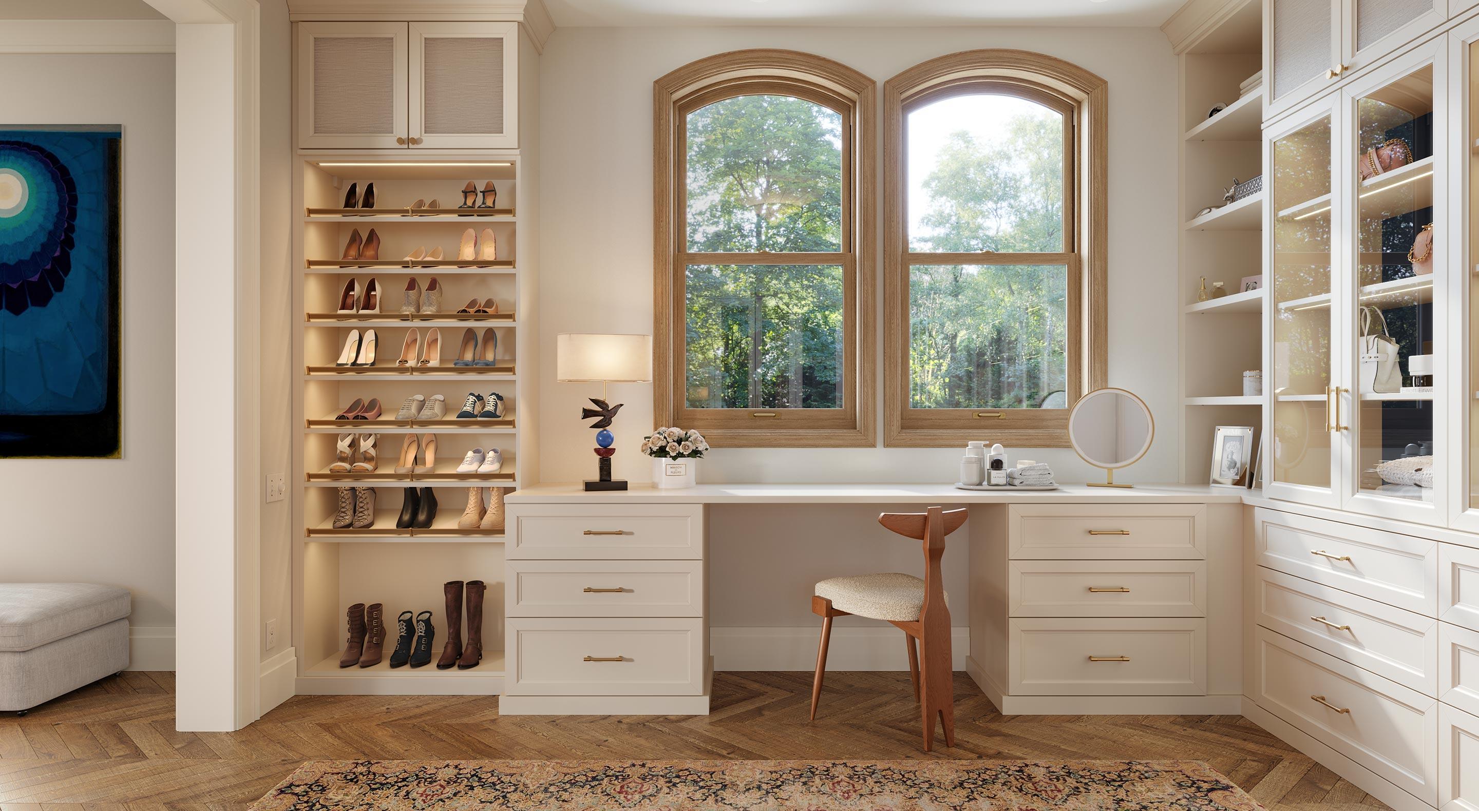 Home office meets custom closet with built in desk, wardrobe storage and shoe shelves by California Closets