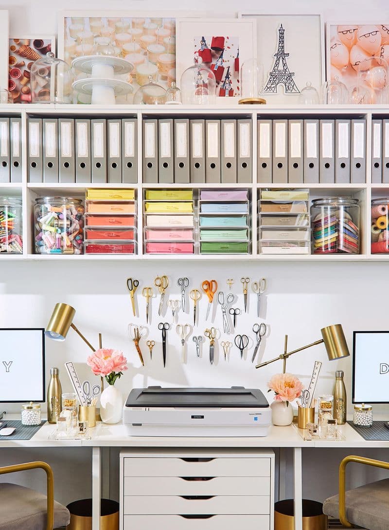 Crafting space oraganizers and extra shelving with storage cubbies by California Closets