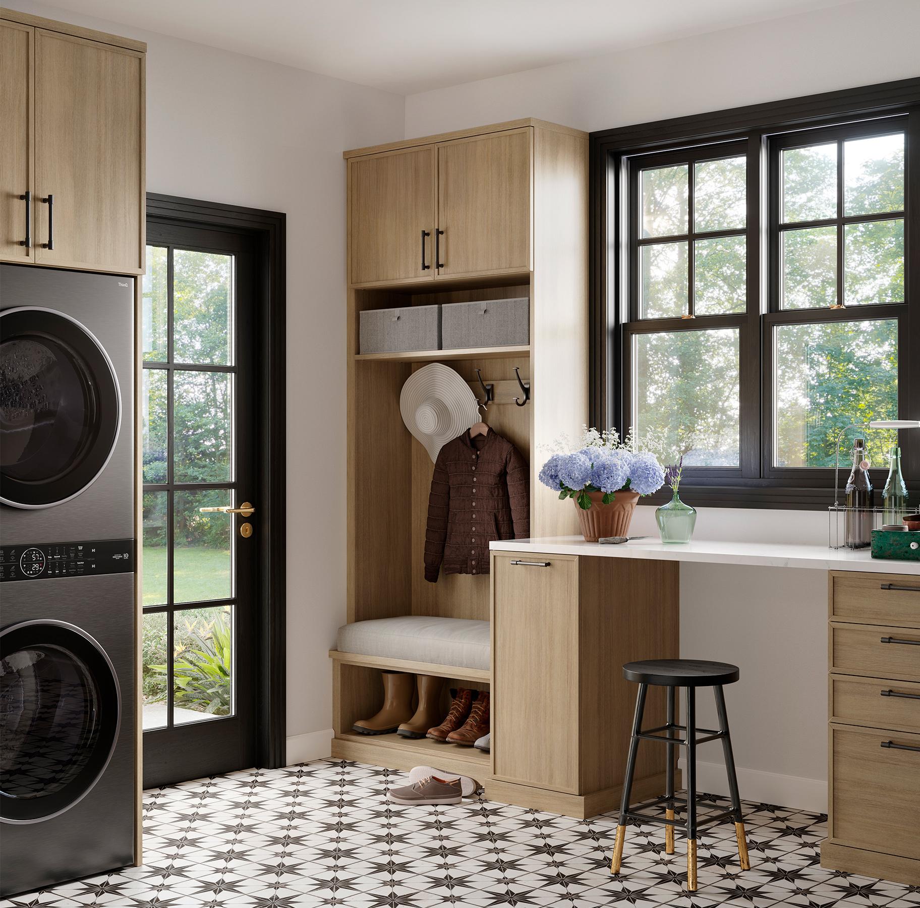 Custom entryway and laundry room with workbench with storage space by California Closets