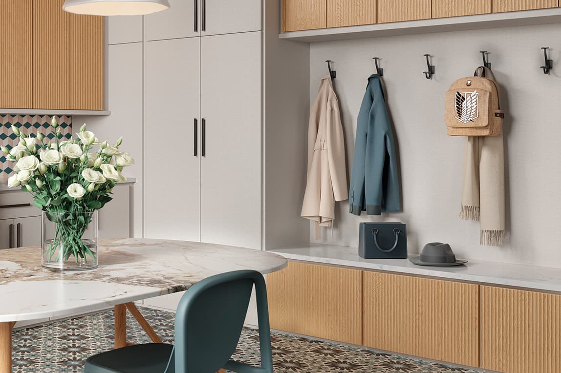 Custom built laundry room with utilty benches and folding table by California Closets