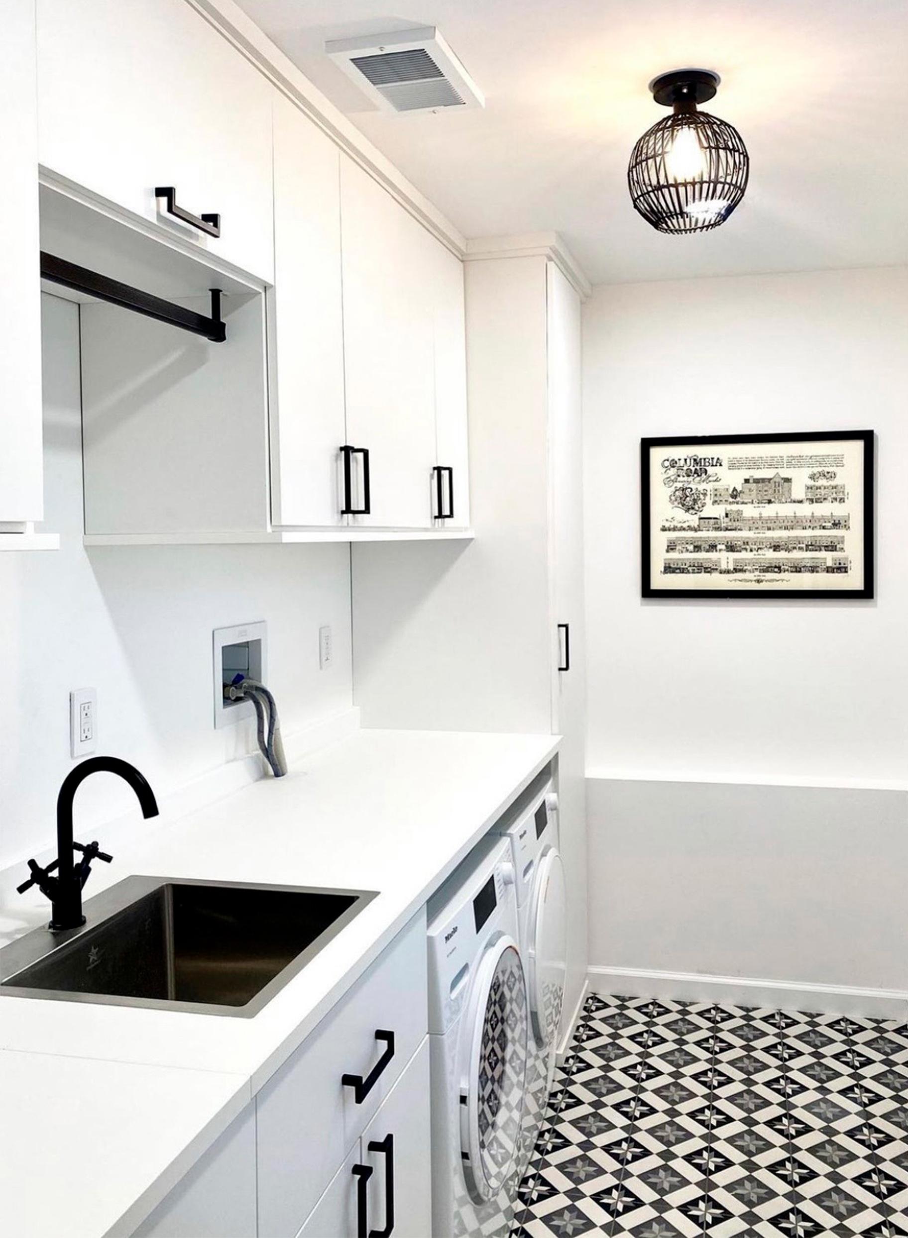 Personalized white laundry toom design with sink, and counterspace by California Closets