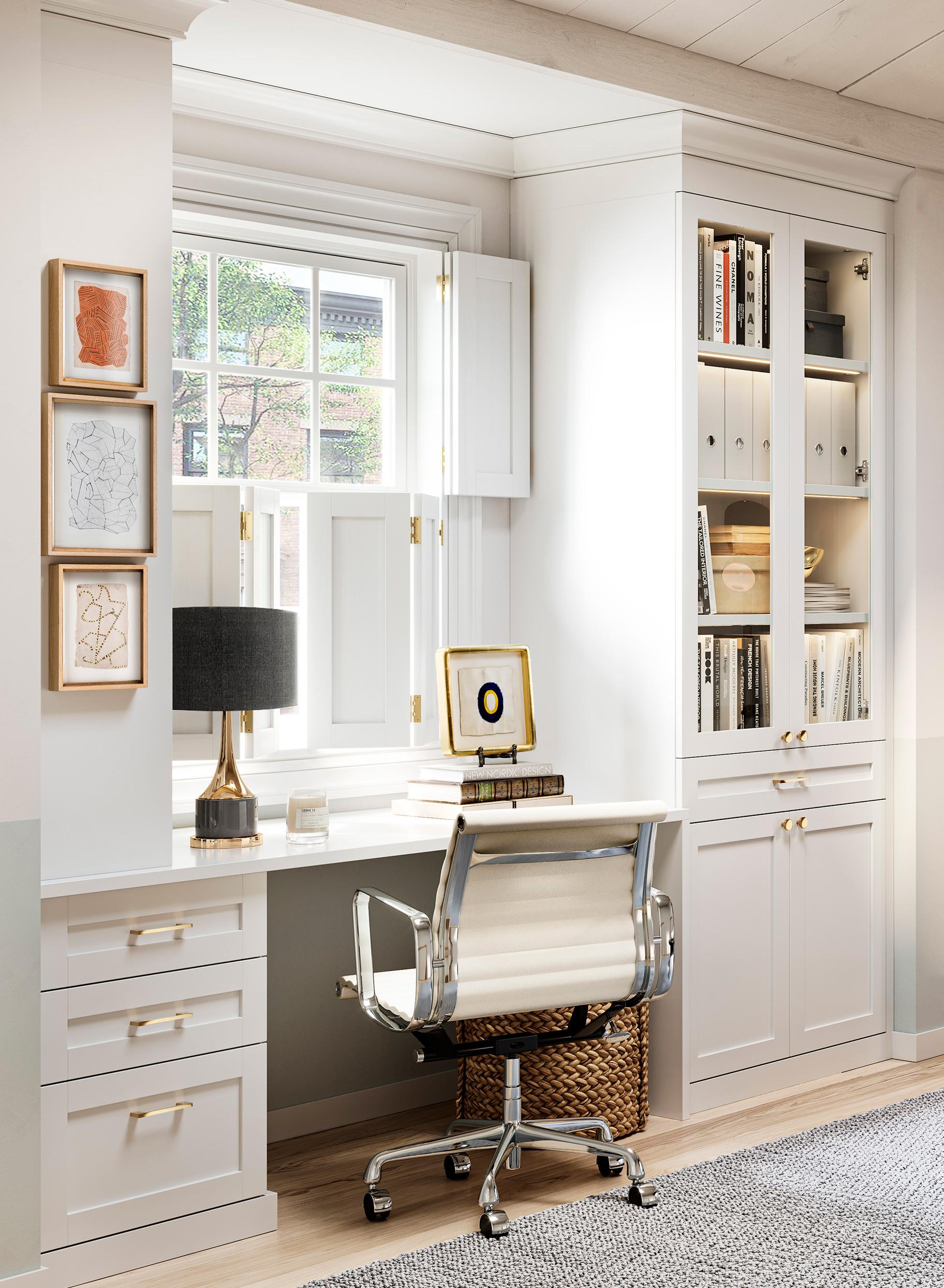 Habitación abuhardillada convertida en espacio de oficina en casa y estanterías de biblioteca por California Closets