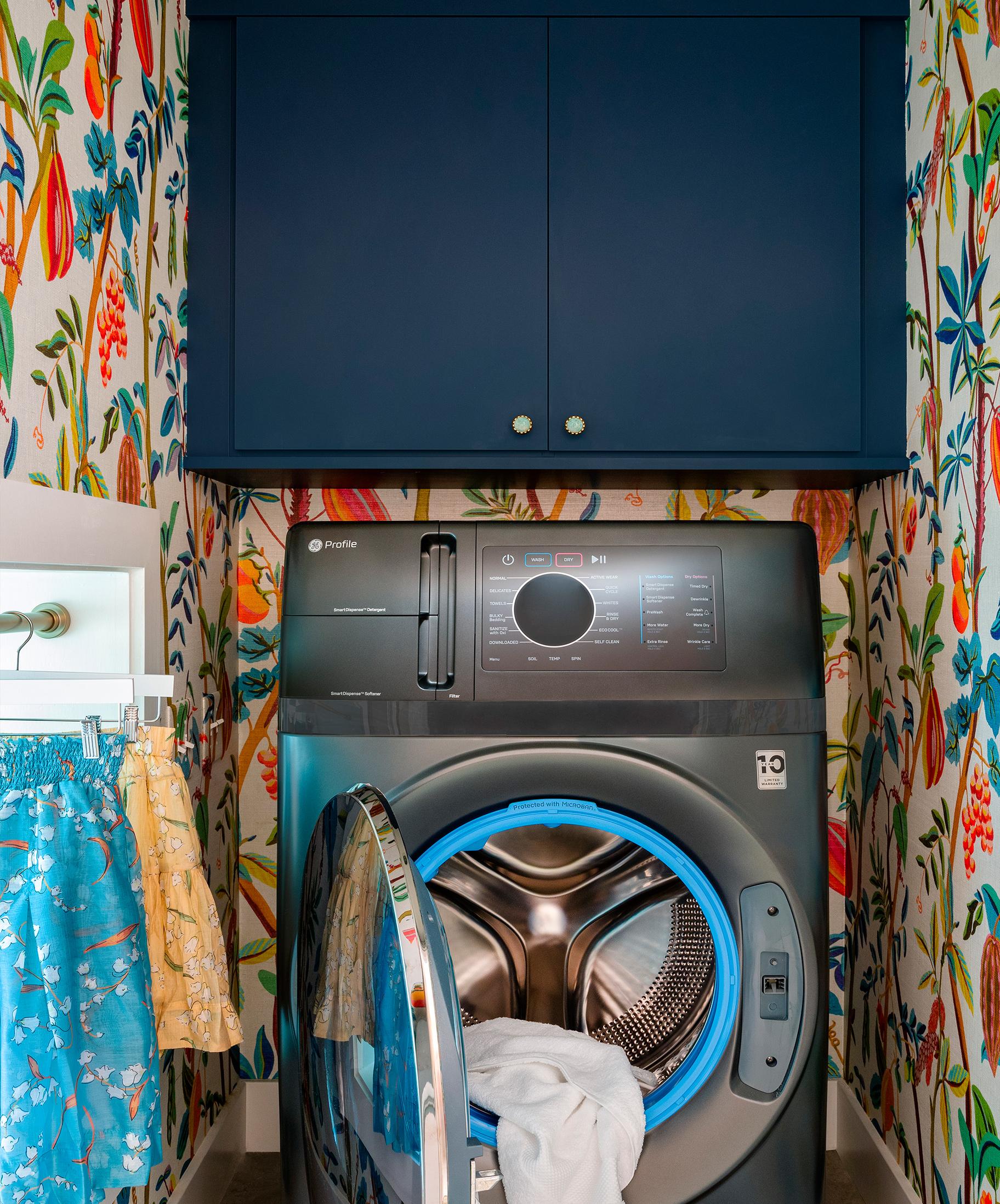 Laundry room design in a small space custom made in a navy finish California Closets