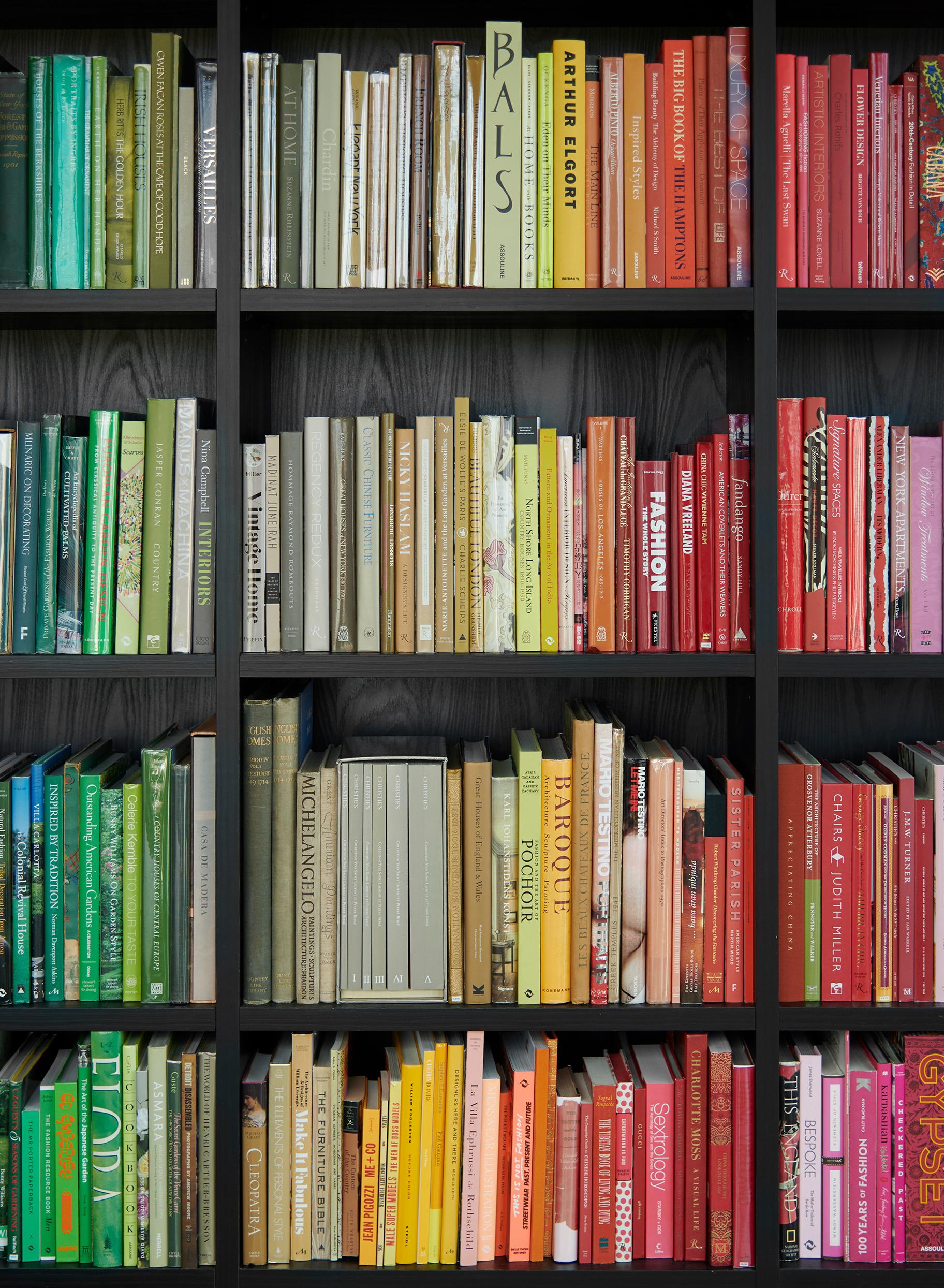 Custom library with tall bookshelves custom designed in a Shadow black finish by California Closets