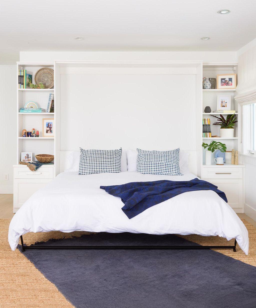 Shoreline appeal bedroom with wall bed opened queen size by California Closets