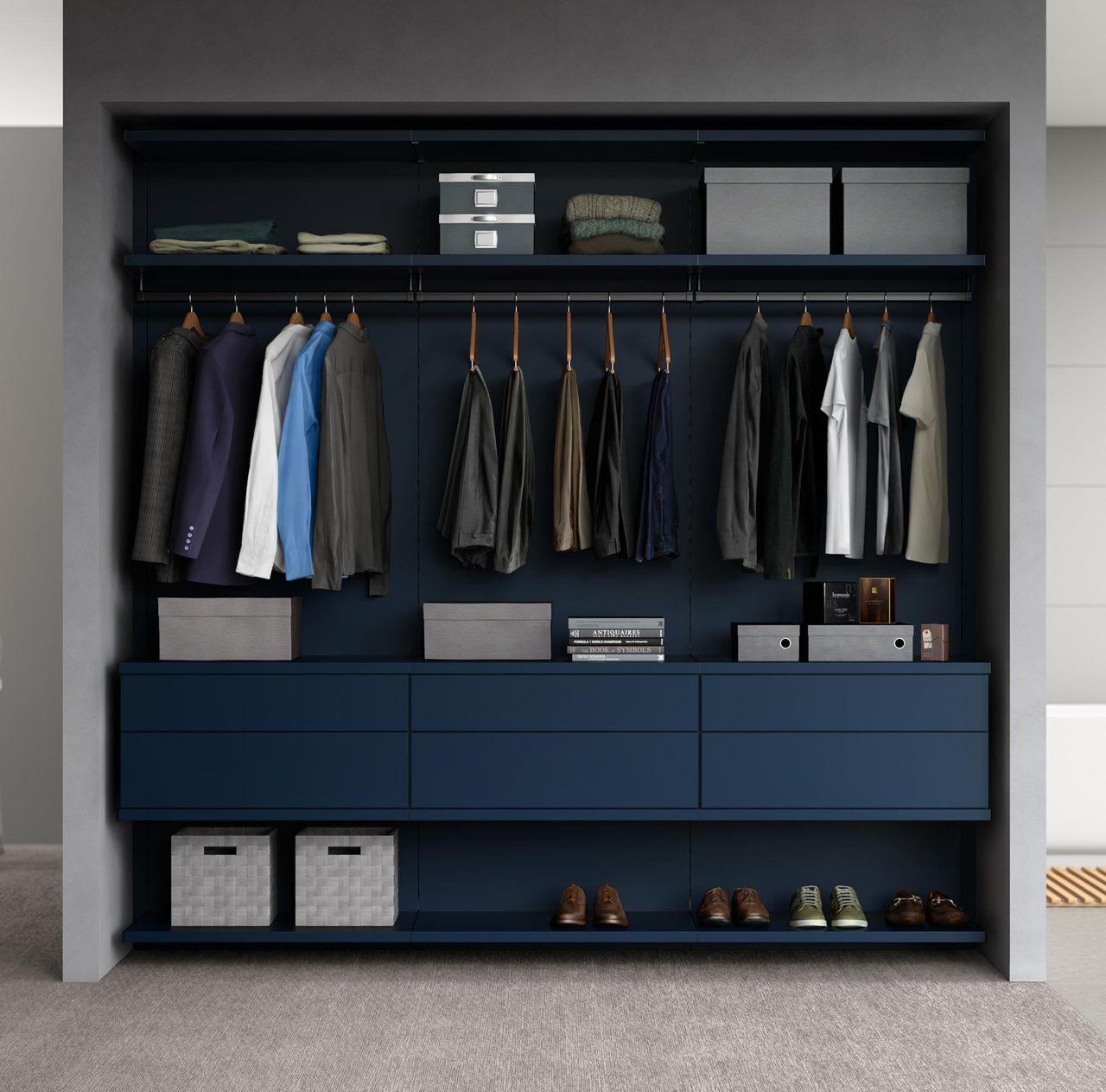 Custom reach in closet in a navy matte finish made by California Closets.