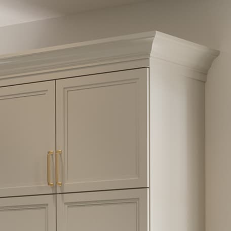 Custom wardrobe closet design with molding and trim created by California Closets