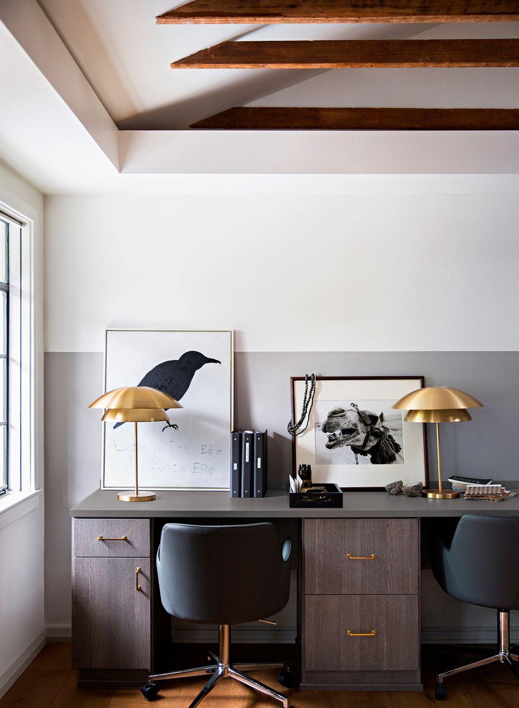 Small office custom built in desk with cabinets and drawers in dark wood grain finish by California Closets