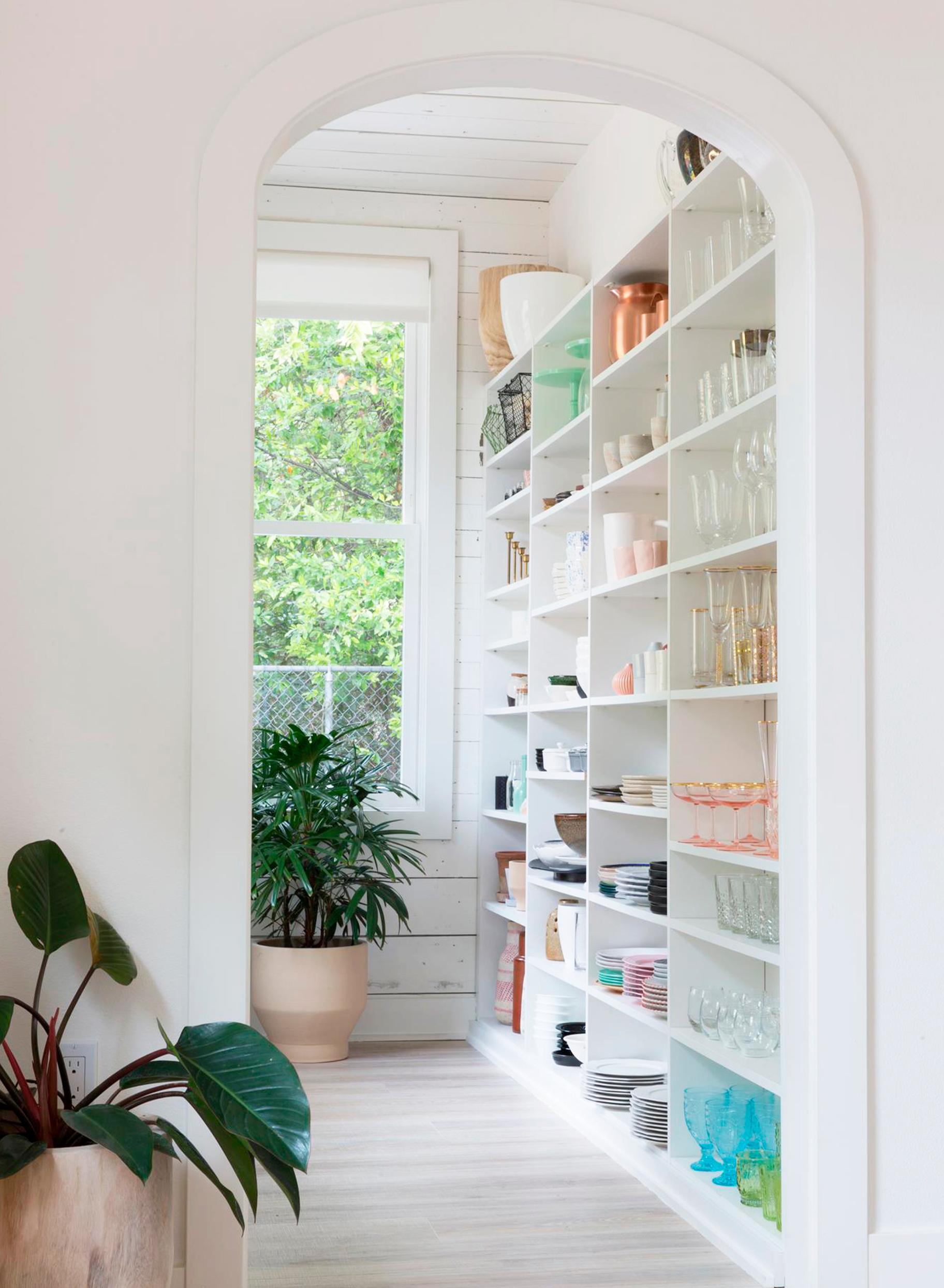 Modern open built kitchen pantry with open shelving by California Closets