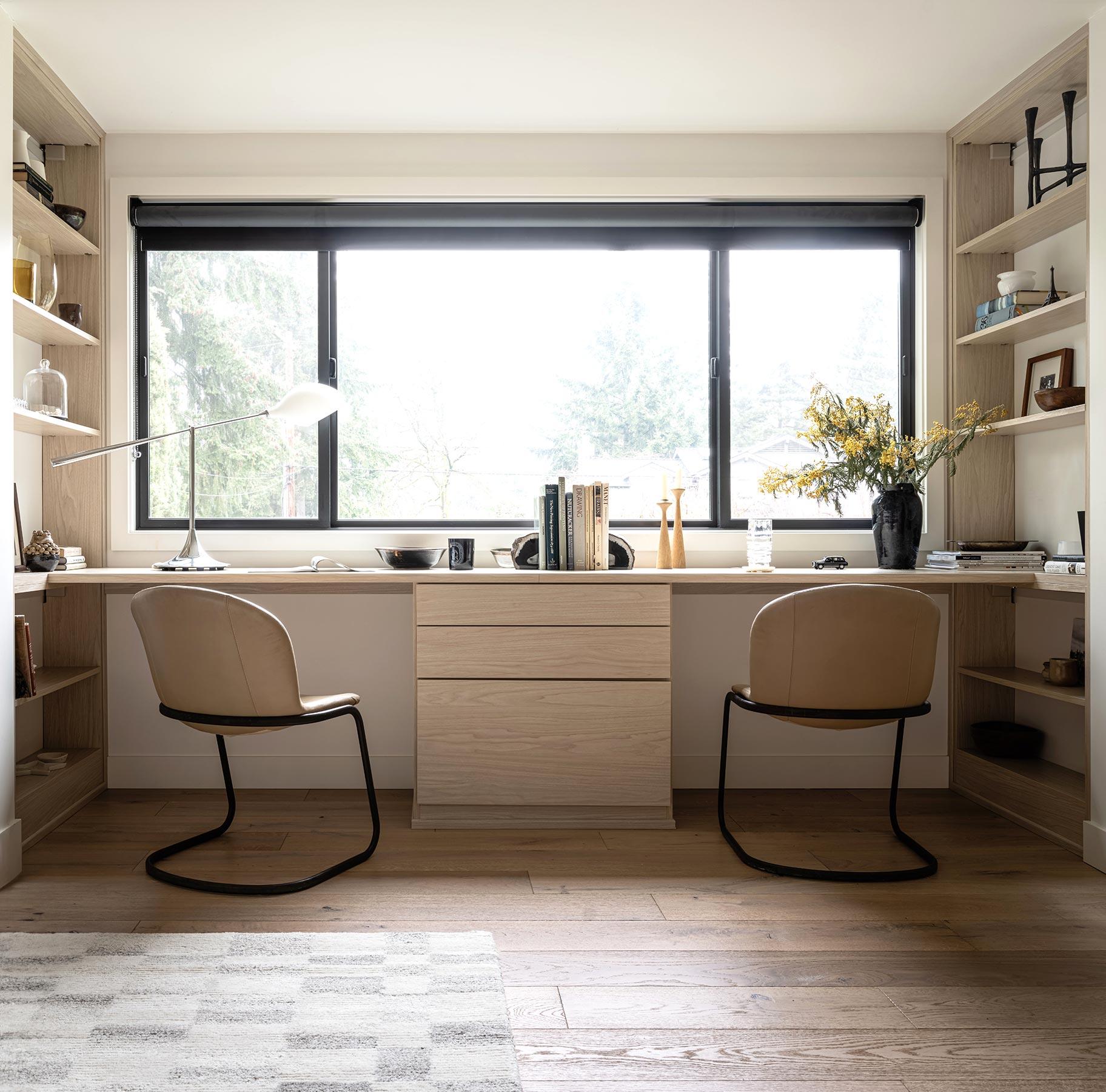 Custom-designed built in desk and shelves in light wood finish from California Closets
