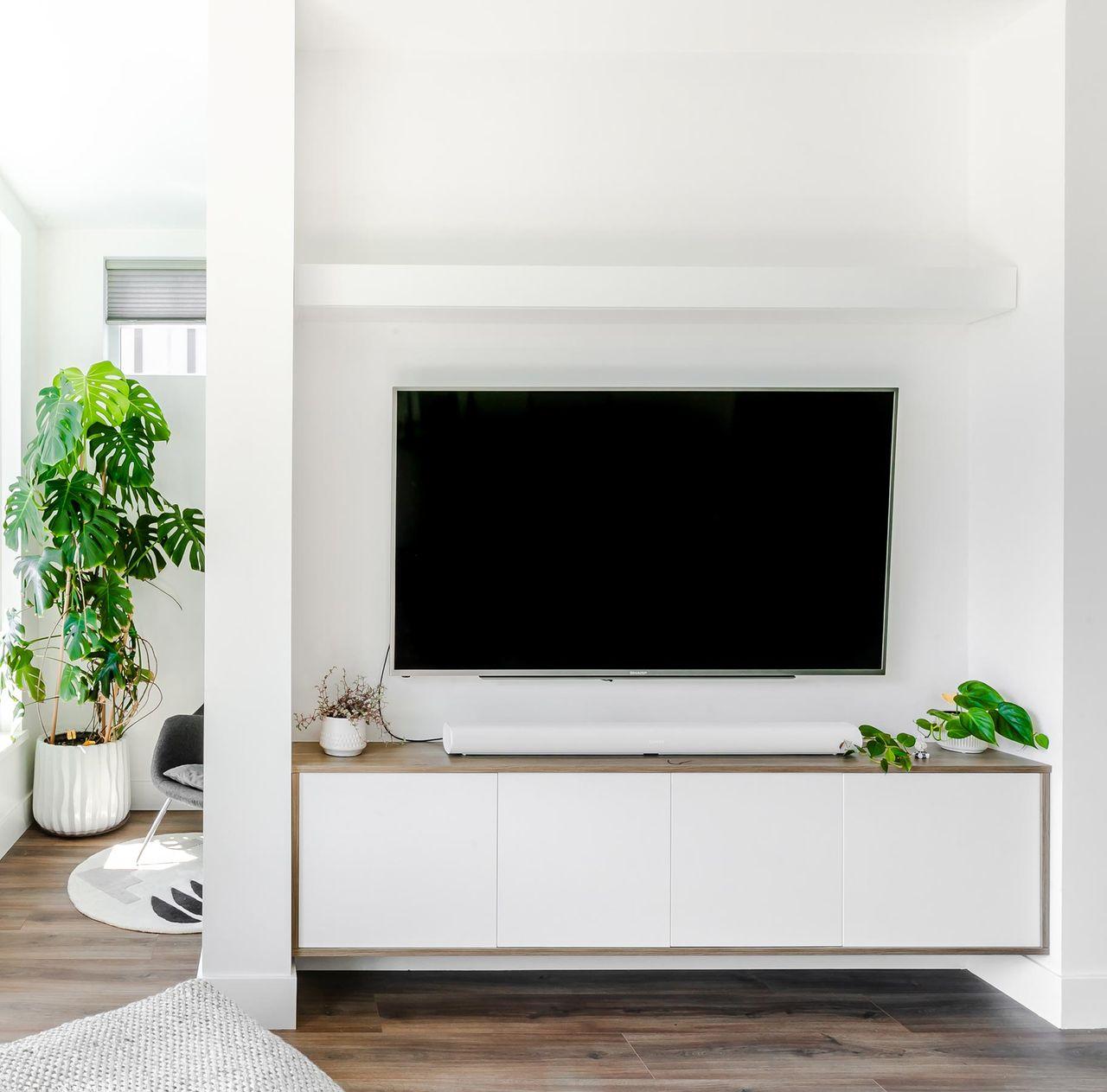 Custom-built-media center wall with floating cabinets by California Closets