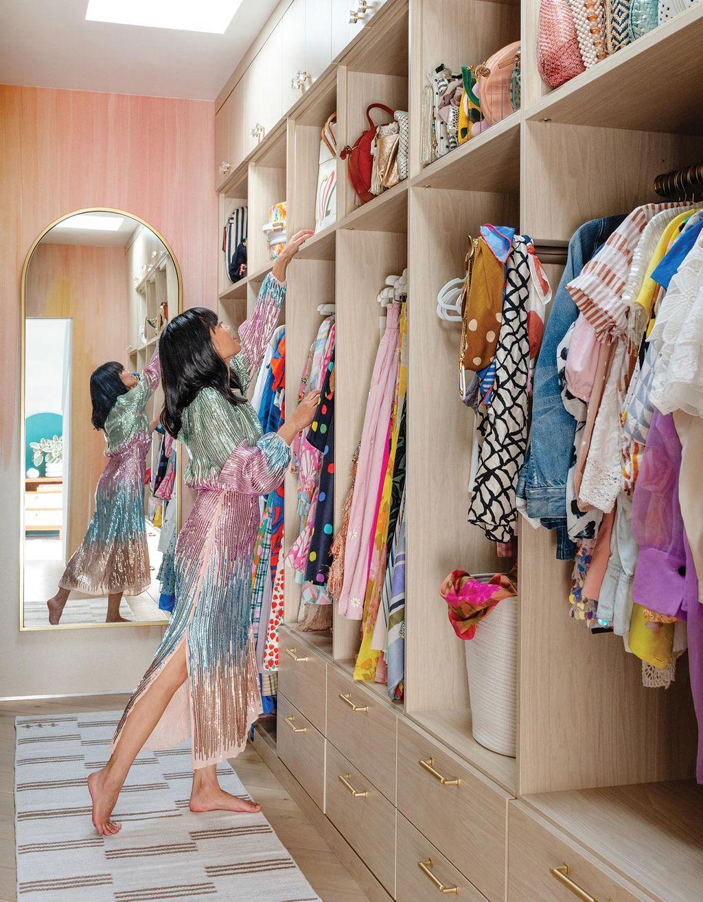 Joy Cho walk in closet design in light wood finish from California Closets