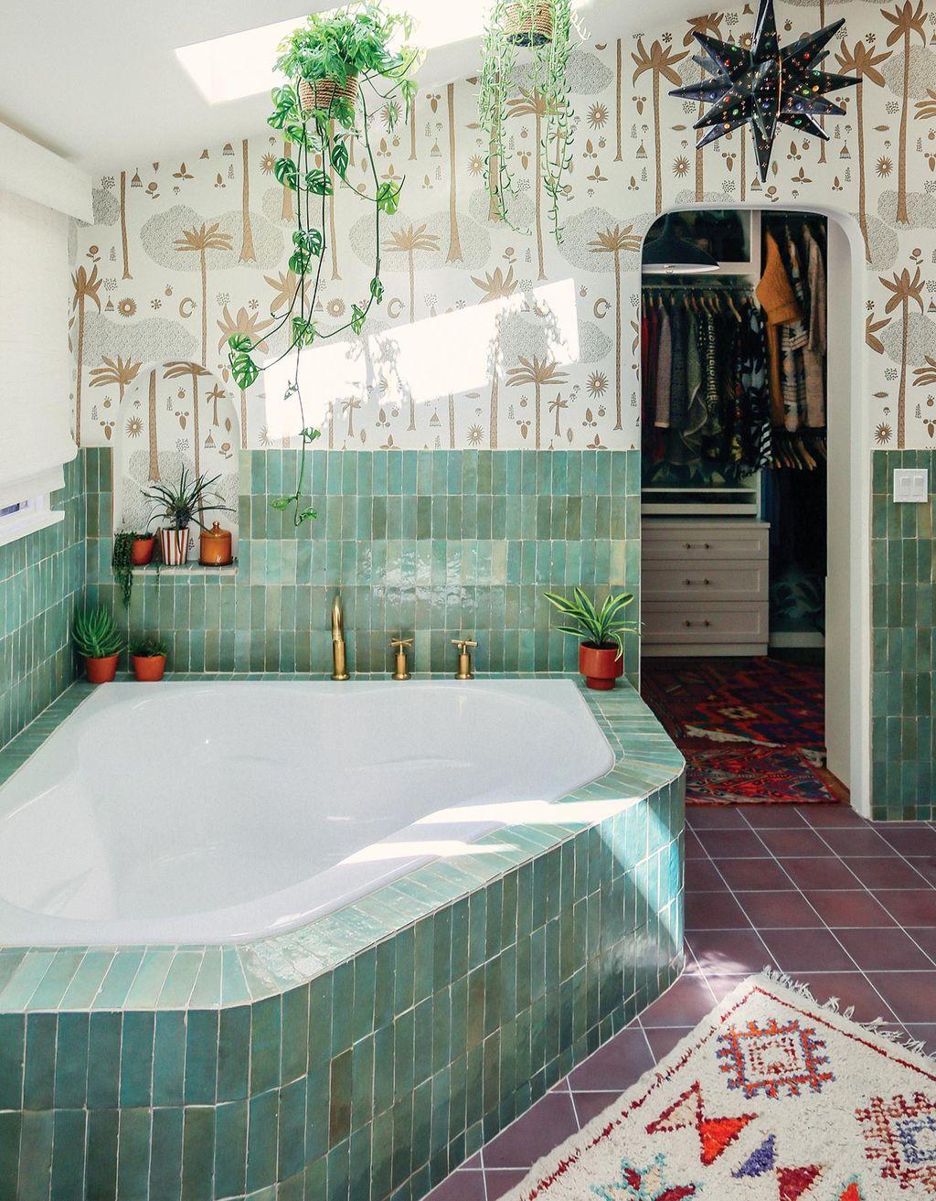 Justina Blakeney's bathroom designed with colorful tile and wallpaper with custom storage in Ideas of Order Magazine