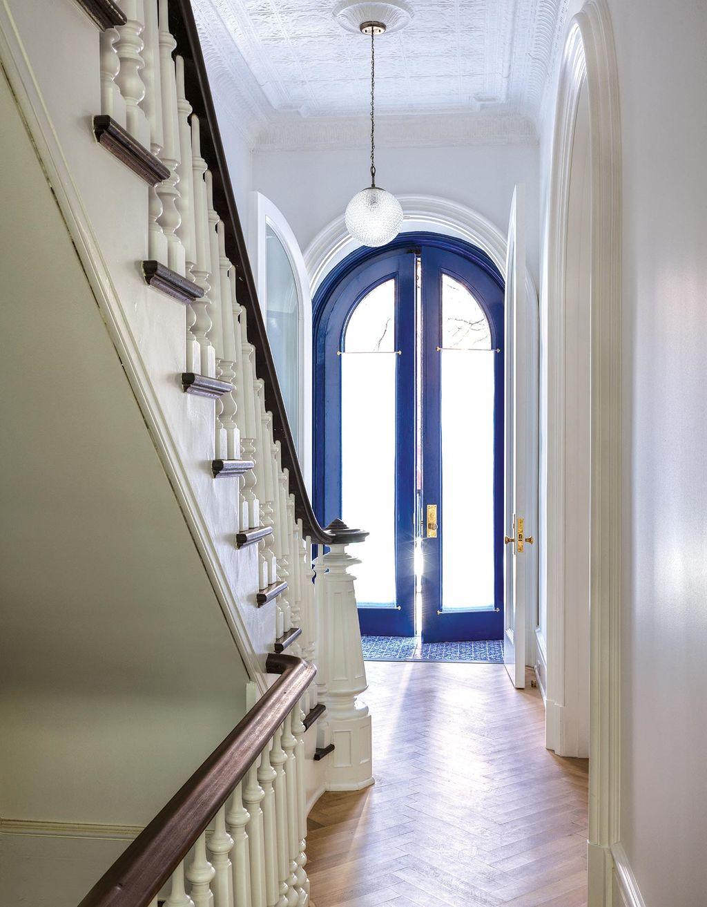 The vivid blue of the doors at the entryway of their Brooklyn home was inspired by doorways Suleika from  Tunisia - Ideas of Order Magazine