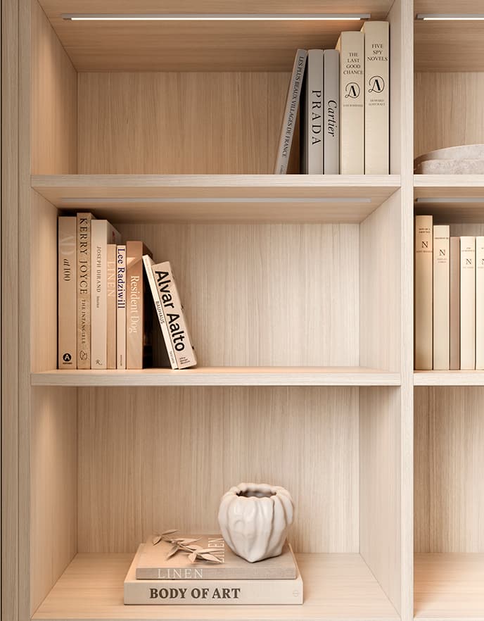 Custom bookshelves designed in light grey wood finish for living room from California Closets